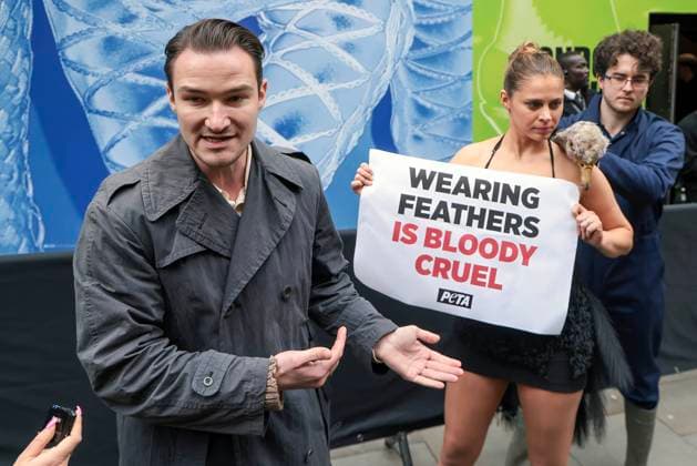 . 21 02 2025. London, United Kingdom. PETA Pluck Ostrich Outside London Fashion Week. A PETA ostrich will has her feathers torn from her body, leaving her bloodied and traumatised, to show Fashion Week attendees what ostriches and other birds may endure in the cruel feather industry for nothing more than some feather trim on a gown.  xMartynxWheatleyx xi-Imagesx IIM-25754-0013
