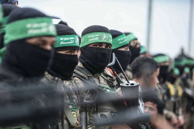 Hamas fighters gather at the site of the handing over of Israeli hostages at the Nuseirat refugee camp Hamas fighters gather at the site of the handing over of Israeli hostages at the Nuseirat refugee camp in the central Gaza Strip as part of the seventh hostage-prisoner release in the central Gaza Strip on February 22, 2025. Hamas s armed wing confirms it will hand over six hostages held alive in the Gaza Strip as part of the ongoing ceasefire deal with Israel. Photo by Omar Ashtawy apaimages Nuseirat Gaza Strip Palestinian Territory 220225_Nusairat_OSH_00(23) Copyright: xapaimagesxOmarxAshtawyx xapaimagesx