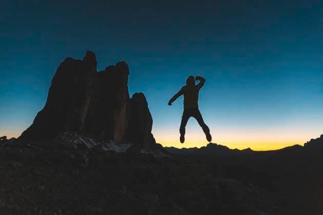 Creative Highlights Symbolfotos Italy, Tre Cime di Lavaredo, silhouette of a man jumping at the three peaks at dusk model released, Symbolfoto, WPEF01340