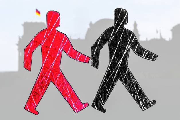 GroKo Schwarz-Rot, Symbolfoto für die Große Koalition, Februar 2025 Deutschland, Februar 2025, schwarz-rote Ampelmännchen, Symbolfoto für eine Große Koalition aus CDU CSU und SPD, vor der Silhouette des Reichstag, Symbol, symbolisch, Symbolbild, Symbolik, Bundestagswahl, Wahlen,
