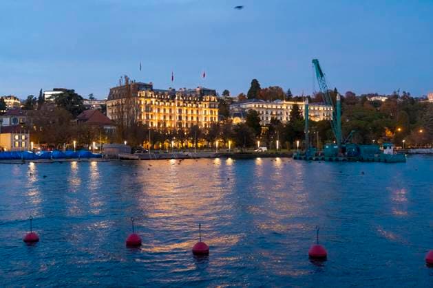 Illuminated cityscape of Lausanne at blue hour with Lake Geneva and boats, Lausanne Vaud Switzerland westend TAMF04717