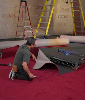 Crew members roll out the red carpet in preparation for the 97th Academy Awards in the Hollywood section of Los Angeles, California on Wednesday, February 26, 2025. Oscar winners will be announced during an ABC live telecast on March 2.  LAP2025022605 JIMxRUYMEN