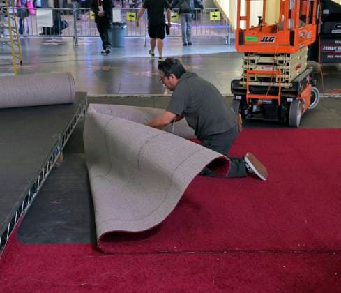 Crew members roll out the red carpet in preparation for the 97th Academy Awards in the Hollywood section of Los Angeles, California on Wednesday, February 26, 2025. Oscar winners will be announced during an ABC live telecast on March 2.  LAP2025022603 JIMxRUYMEN