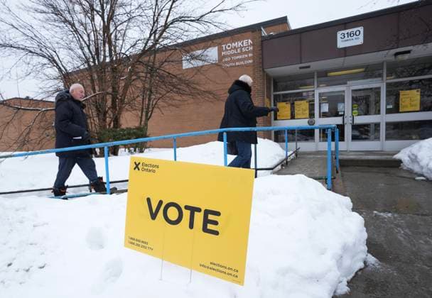 February 27, 2025, Mississauga, On, CANADA: People walk in to vote in the Ontario provincial election at a school in Mississauga, Ont., on Thursday, Feb. 27, 2025. Mississauga CANADA  - ZUMAc35_ 20250227_zaf_c35_002 Copyright: xNathanxDenettex