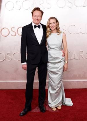 (L-R) Conan O Brien and Liza Powel O Brien arrive on the red carpet for the 97th Academy Awards in the Hollywood section of Los Angeles on Sunday, March 2, 2025.  LAP20250302762 JOHNxANGELILLO