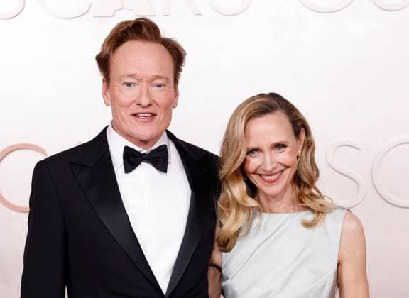(L-R) Conan O Brien and Liza Powel O Brien arrive on the red carpet for the 97th Academy Awards in the Hollywood section of Los Angeles on Sunday, March 2, 2025.  LAP20250302775 JOHNxANGELILLO