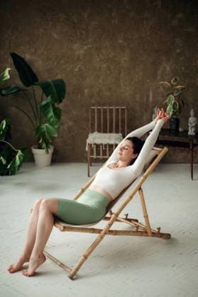 Creative Highlights Symbolfotos Beautiful young woman sitting on a sunbad chair in a room and relaxing Lviv, Lviv Oblast, Ukraine R_JUCE250228A-1670982-01 ,model released, Symbolfoto