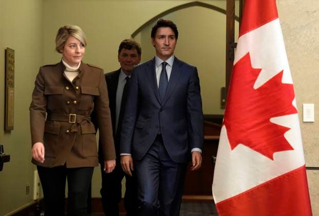 March 4, 2025, Ottawa, On, Canada: Prime Minister Justin Trudeau, Foreign Affairs Minister Melanie Joly and Finance Minister Dominic LeBlanc arrive for a news conference on imposed U.S. tariffs in Ottawa on Tuesday, March 4, 2025. Ottawa Canada  - ZUMAc35_ 20250304_zaf_c35_038 Copyright: xAdrianxWyldx