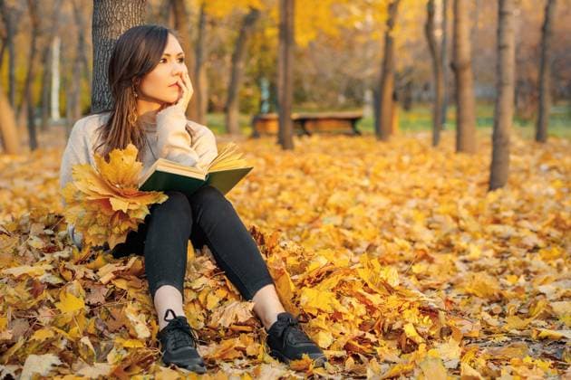 A young woman sits with a book in her hands on autumn foliage near a tree and dreams about something., model released, , 51901288.jpg, woman, book, autumn, park, education, person, nature, face, sun, leaf, female, outdoor, young, lifestyle, cute, portrait, attractive, fall, leisure, casual, hair, reading, read, self-development, copy space RECORD DATE NOT STATED