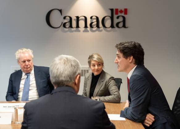 March 7, 2025, Montreal, Pq, CANADA: Prime Minister Justin Trudeau,right, flanked by from left to right, Jean Charest, member of his council on Canada-U.S. relations, Foreign Affairs Minister Melanie Joly, and Minister of Innovation, Science and Industry Francois-Philippe Champagne hosts a round table with business community leaders in Montreal on Friday, March 7, 2025. Montreal CANADA  - ZUMAc35_ 20250307_zaf_c35_044 Copyright: xChristinnexMuschix