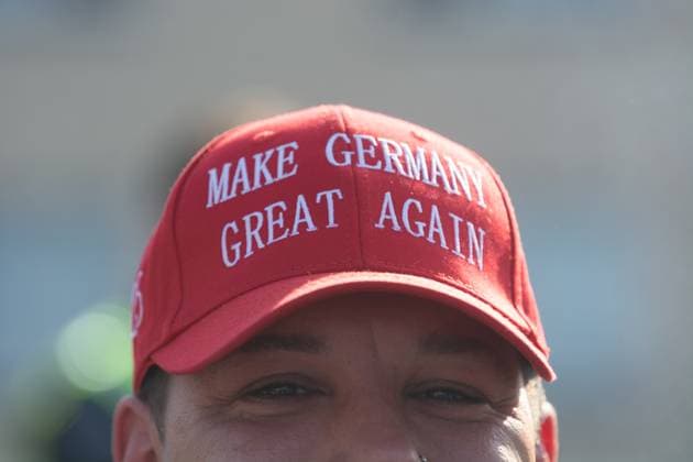 News Themen der Woche KW10 AFD Rally For International Women s Day And Counter Protest In Essen An AFD supporter with a Make Germany Great Again hat is seen as the AFD party holds a rally to mark International Women s Day in Essen, Germany, on March 8, 2025. Essen Germany  Copyright: xYingxTangx originalFilename: tang-notitle250308_np7Bo.jpg