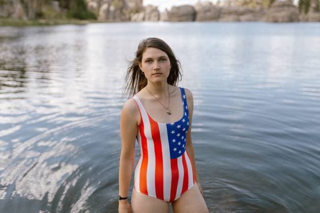 Creative Highlights Symbolfotos Woman in patriotic swimsuit standing in Sylvan Lake, SD Custer, South Dakota, United States CR_YFNE250307A-1475292-01 ,model released, Symbolfoto