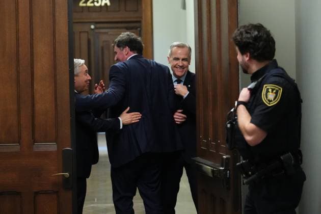 March 10, 2025, Ottawa, On, Canada: Liberal Leader Mark Carney (right) smiles as he tries to get past Finance Minister Dominic LeBlanc (centre) and Industry Minister Francois-Philippe Champagne to leave a caucus meeting in Ottawa, Monday, March 10, 2025. Ottawa Canada  - ZUMAc35_ 20250310_zaf_c35_061 Copyright: xSeanxKilpatrickx