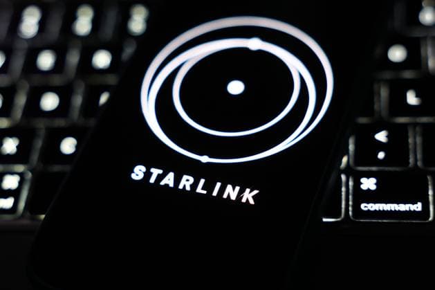 Starlink Photo Illustrations A laptop keyboard and Starlink logo displayed on a phone screen are seen in this illustration photo taken in Krakow, Poland on March 11, 2025. Krakow French Polynesia  Copyright: xJakubxPorzyckix originalFilename: porzycki-starlink250311_npDzQ.jpg