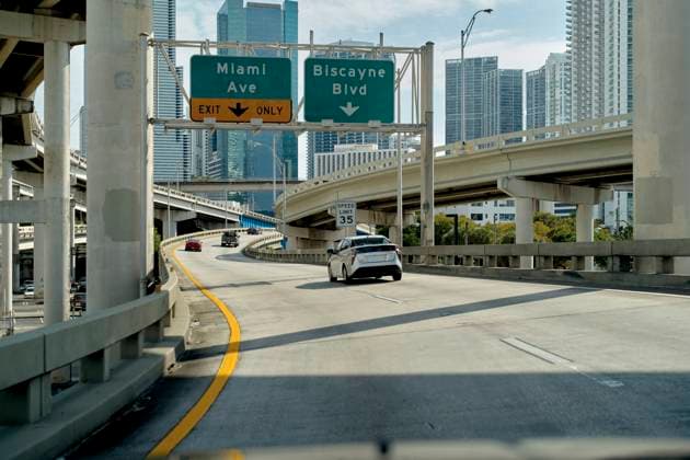 Urban highway scene with cars and road signs for Miami Ave and Biscayne Blvd in a cityscape. Miami, FL, USA Miami Florida USA bola07721 Copyright: xConnectxImagesx