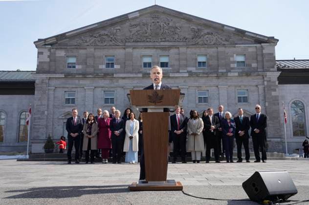 March 14, 2025, Ottawa, On, Canada: Prime Minister Mark Carney holds a press conference as members of his cabinet look on following a swearing in ceremony at Rideau Hall in Ottawa on Friday, March 14, 2025. Ottawa Canada  - ZUMAc35_ 20250314_zaf_c35_169 Copyright: xAdrianxWyldx