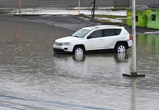 March 17, 2025, Beauceville, Pq, Canada: A car left in a parking lot is getting flooded as the water rises again in Beauceville, Que., Monday, March 17, 2025. The Chaudiere river flooded the city after an ice blockage overnight. Beauceville Canada  - ZUMAc35_ 20250317_zaf_c35_089 Copyright: xJacquesxBoissinotx