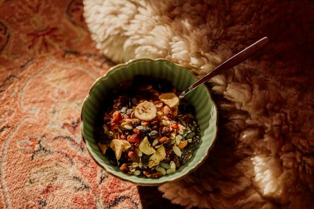 Healthy Granola Bowl on Rug in sunlight Amsterdam, North Holland, Netherlands R_RTBZ2503181C-1686200-01