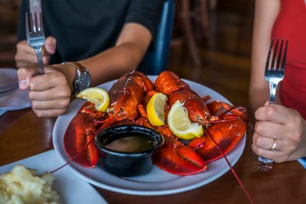 A hungry pair waiting to try some freshly caught lobster in New England. Copyright: xLoopxImages TysonxPaulx TPL01024WT025