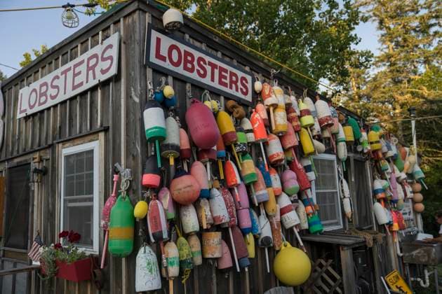 A seafood shack decorated with brightly coloured lobster buoys in New England. Copyright: xLoopxImages TysonxPaulx TPL01024WT101