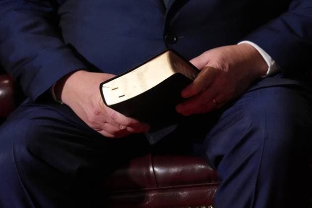 March 19, 2025, Toronto, On, CANADA: Premier Doug Ford holds a bible ahead of reaffirming his oath as premier of Ontario during a cabinet swearing-in ceremony in Toronto on Wednesday, March 19, 2025. Toronto CANADA  - ZUMAc35_ 20250319_zaf_c35_041 Copyright: xNathanxDenettex