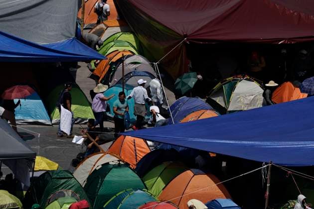 March 19, 2025, Mexico City, Cdmx, Mexico: Thousands of teachers from the National Coordinator of Education Workers (CNTE) are holding a 72-hour sit-in, setting up tents and banners in Constitution Square, in front of the National Palace in Mexico City, despite President Claudia Sheinbaum s decision to withdraw the initiative to reform the Law of the Institute of Security and Social Services for State Workers Mexico City Mexico - ZUMAp204 20250319_zip_p204_029 Copyright: xJosuexPerezx