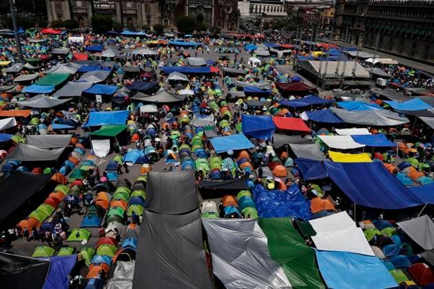 March 19, 2025, Mexico City, Cdmx, Mexico: Thousands of teachers from the National Coordinator of Education Workers (CNTE) are holding a 72-hour sit-in, setting up tents and banners in Constitution Square, in front of the National Palace in Mexico City, despite President Claudia Sheinbaum s decision to withdraw the initiative to reform the Law of the Institute of Security and Social Services for State Workers Mexico City Mexico - ZUMAp204 20250319_zip_p204_031 Copyright: xJosuexPerezx