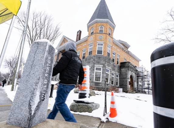March 21, 2025, Derby Line, Vt, USA: A person walks over the international border into Canada in front of the Haskell Free Library and Opera House in Derby Line, Vt., on Friday, March 21, 2025. The town of Stanstead, Que., says U.S. authorities have unilaterally decided to close the main Canadian access to the Victorian-style library that straddles the border between the two countries. Derby Line USA - ZUMAc35_ 20250321_zaf_c35_019 Copyright: xChristinnexMuschix