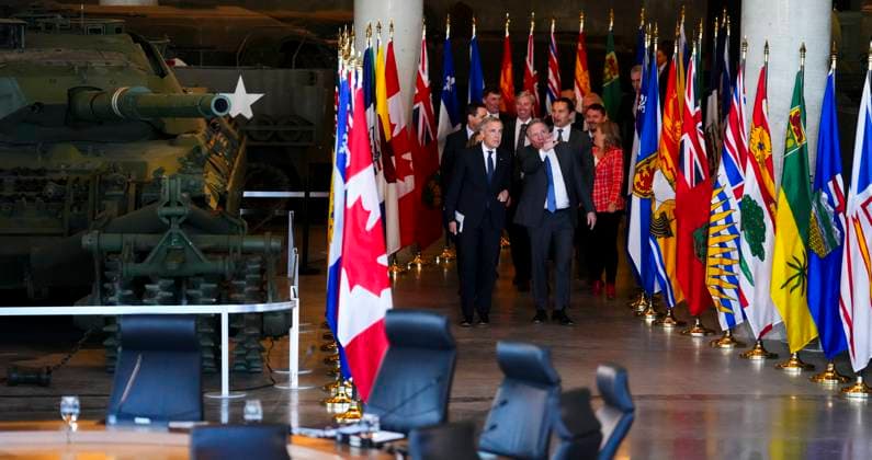 March 21, 2025, Ottawa, Ontario, Canada: Prime Minister Mark Carney, front, walks alongside Francois Legault, Premier of Quebec, as they are joined by first ministers as they arrives to take part in the First Minister Meeting at the National War Museum in Ottawa on Friday, March 21, 2025. Ottawa Canada - ZUMAc35_ 20250321_zaf_c35_068 Copyright: xSeanxKilpatrickx