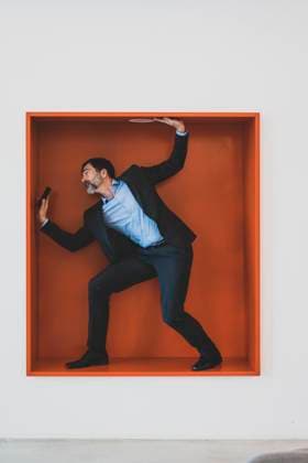 Creative Highlights Symbolfotos Mature businessman with cell phone caught in a niche model released, Symbolfoto property released, MOEF02607