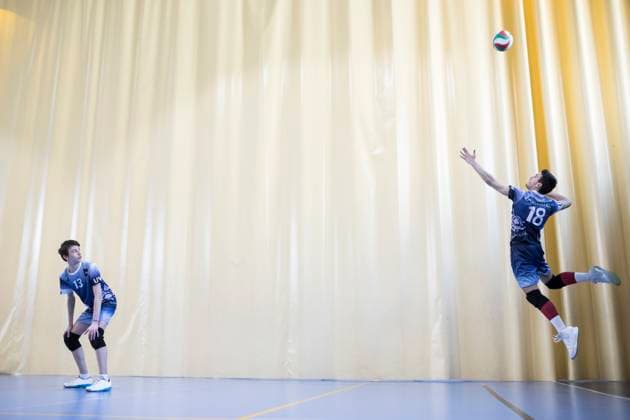 Creative Highlights Symbolfotos Man jumping during a volleyball match to start a game model released, Symbolfoto property released, ABZF02839