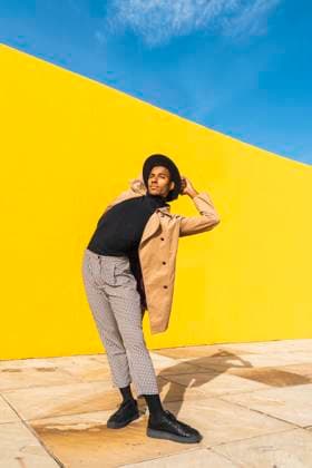Creative Highlights Symbolfotos Young man dancing in front of yellow wall model released, Symbolfoto, AFVF04535