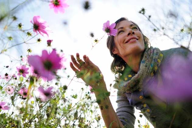 Creative Highlights Symbolfotos Portrait of women smelling on wild flower, flower meadow model released, Symbolfoto, ECPF00792