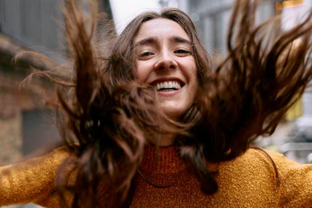 Creative Highlights Symbolfotos Carefree woman with long hair laughing and spinning outdoors model released, Symbolfoto, ASGF06236
