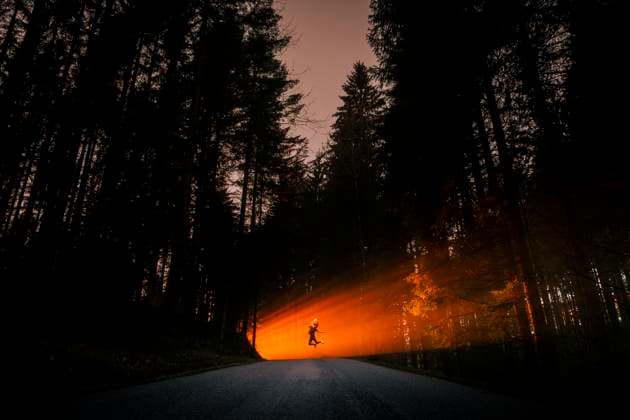 Creative Highlights Symbolfotos Silhouette of a woman jumping in a misty forest at sunset model released, Symbolfoto, WVF02161