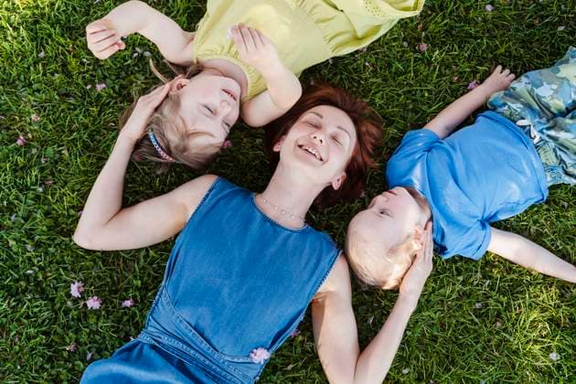 Creative Highlights Symbolfotos Mother with children enjoying a sunny day in a green park during spring model released, Symbolfoto, NDEF02244