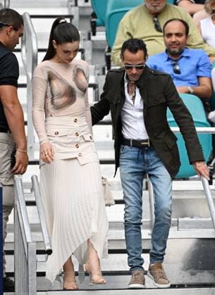 MIAMI GARDENS FL - MARCH 23: Marc Anthony and his wife Nadia Ferreira are seen watching Novak Djokovic Vs Camilo Ugo Carabelli during The Miami Open at Hard Rock Stadium on March 23, 2025 in Miami Gardens, Florida. Copyright: xmpi04x