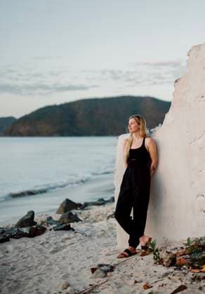 Creative Highlights Symbolfotos Woman stands among ruins at Cinnamon Bay, Virgin Islands Cruz Bay, St. John, U.S. Virgin Islands CR_SSNF250321-1678718-01 ,model released, Symbolfoto