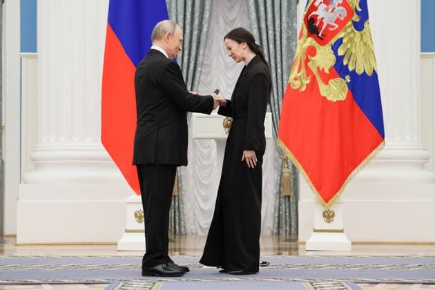 RUSSIA, MOSCOW - MARCH 25, 2025: Russia s President Vladimir Putin (L) and Russian Presidential Prize winner, Mariinsky Theatre ballet dancer Renata Shakirova are seen during a ceremony in the Kremlin to present Russian Presidential Prizes in Culture, Literature and Art for Year 2024 to young professionals for their works aimed at children and youth. Sergei Savostyanov TASS  79356438