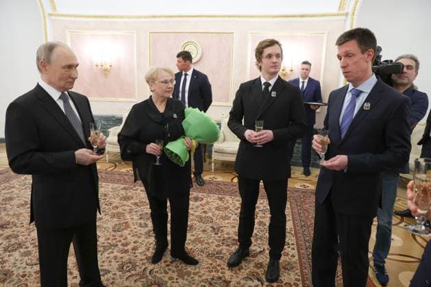 RUSSIA, MOSCOW - MARCH 25, 2025: Russia s President Vladimir Putin (L) chats with Russian Presidential Prize winners after a ceremony in the Kremlin in which President Putin presented Russian Presidential Prizes in Culture, Literature and Art for Year 2024 to young professionals for their works aimed at children and youth. From right to left (front): author Leonid Rozhnikov, Artistic Director of the Moscow State Academic Symphony Orchestra Ivan Nikiforchin and Loktev Song and Dance Ensemble head choreographer Marina Yegorova. Vyacheslav Prokofyev Russian Presidential Press and Information Office TASS  79357475