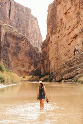 Creative Highlights Symbolfotos Woman wades through Rio Grande in Santa Elena Canyon, Big Bend. Big Bend National Park, Texas, United States CR_XPQF250324-1505480-01 ,model released, Symbolfoto