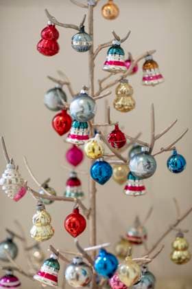 Detail of artificial bare tree with Christmas bulbs hanging Phoenix, Arizona, United States R_MALI250325-1688259-01