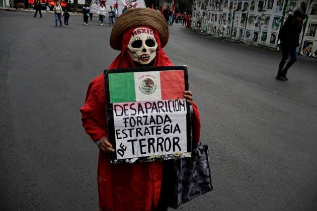 March 26, 2025, Mexico City, Cdmx, Mexico: Mothers, fathers, relatives, and classmates of the 43 students from Ayotzinapa, Guerrero, demonstrate on Paseo de la Reforma Avenue to demand that the government of Claudia Sheinbaum resolve the forced disappearance of the students, which occurred 10 years ago; the Mexican Army, the municipal police, and organized crime are being blamed for this incident. Mexico City Mexico - ZUMAp204 20250326_zip_p204_018 Copyright: xJosuexPerezx