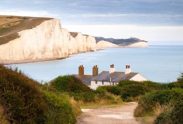 Coastguard cottages at Cuckmere Haven and Seven Sisters cliffs, South Downs National Park, Seaford, East Sussex, England, United Kingdom Copyright: NadiaxIsakova 1352-329