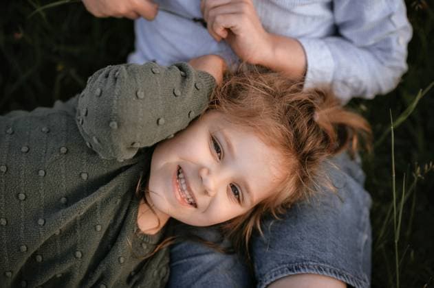 Creative Highlights Symbolfotos sister lies on her brother s lap and looks up Corby, England, United Kingdom R_JNDO250327A-1691103-01 ,model released, Symbolfoto