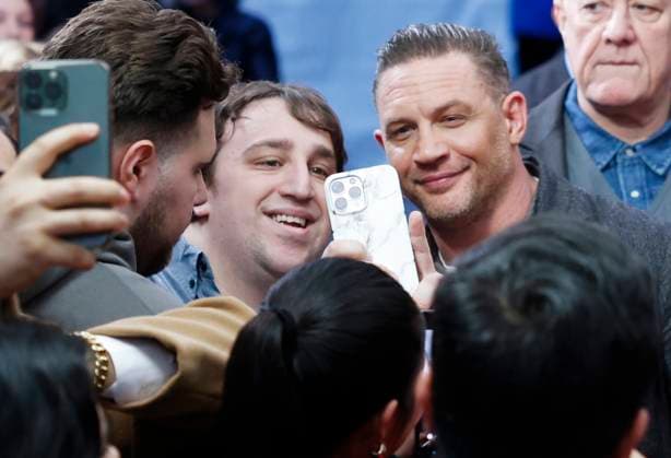 Tom Hardy greets fans when he arrives on the red carpet at the New York premiere of MobLand at the SVA Theatre in New York City on Monday, March 31, 2025.  NYP20250331236 JOHNxANGELILLO