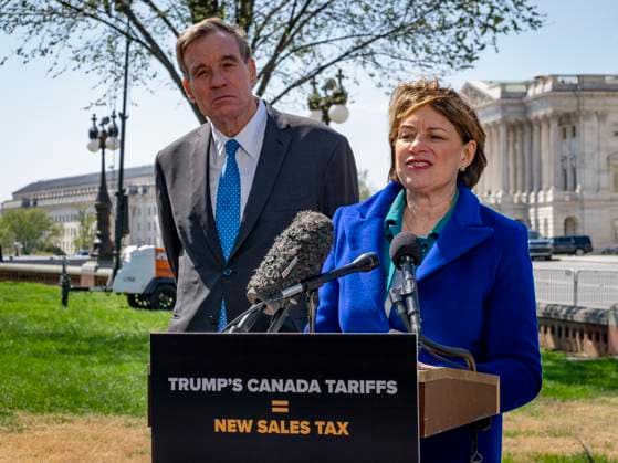April 1, 2025, Washington, District Of Columbia, USA: Senator AMY KLOBUCHAR (D-MN) speaks out against President Trumps Canadian tariffs, warning on negative impacts her states and the United States economy. Senator MARK WARNER (D-VA) listens in the background. Washington USA - ZUMAd155 20250401_znp_d155_005 Copyright: xSuexDorfmanx