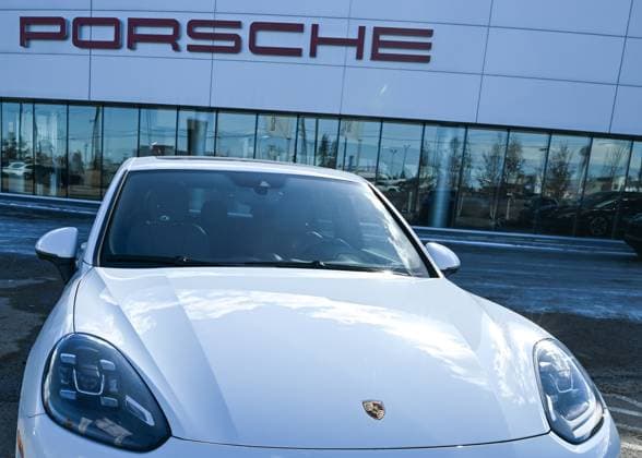 Trump™s 25% Tariff On Imported Vehicles And Auto Parts To Impact Jobs And Economy EDMONTON, CANADA APRIL 2: A file picture of a Porsche vehicle parked outside a Porsche dealership in Edmonton, Alberta, Canada, on April 2, 2025. U.S. President Donald Trump s administration announced a 25% tax on fully-built vehicles and essential auto parts, including engines and transmissions, which will go into effect on April 3. Edmonton Canada  Copyright: xArturxWidakx originalFilename: widak-trumps25250402_nprWB.jpg