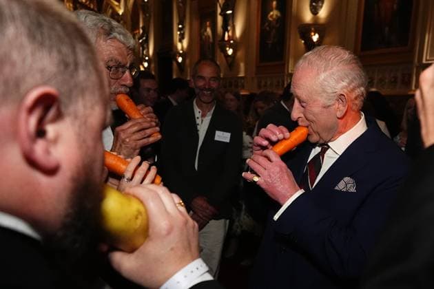 Royal community music reception King Charles III plays a carrot with the London Vegetable Orchestra during a reception to recognise those involved in community music across the UK, at Windsor Castle in Berkshire. The 350 guests include leaders of community music groups and music-related projects, many of whom are volunteers., Credit:Aaron Chown Avalon UK, Windsor  Copyright: xAaronxChownx xAvalonx 0983026991