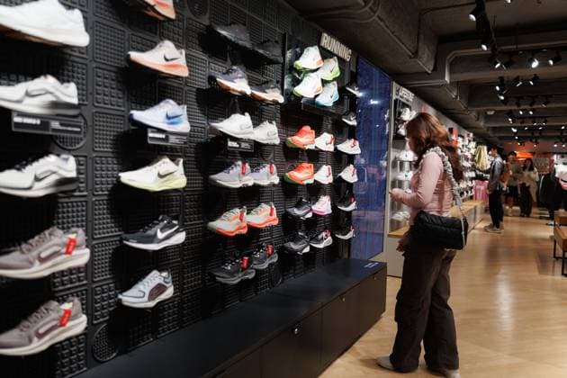 April 6, 2025, Hong Kong, China: A customer looking at Nike shoes inside NikeÃ¢â‚¬â ¢s store in Hong Kong on Sunday, April 6, 2025. Photo .Nike, one of the worldÃ¢â‚¬â ¢s biggest sportswear brands, is facing fresh challenges as the U.S. government announces steep new tariffs on imports from VietnamÃ¢â‚¬up to 49% on some goods. Nearly 50% of its footwear and 28% of its clothing are made in Vietnam..While VietnamÃ¢â‚¬â ¢s government has offered to negotiate with the U.S., even proposing to drop tariffs on American goods, Nike has giving no public response. The situation raises big questions about rising costs, possible delays, and how brands will handle supply chain risks going forward. Hong Kong China - ZUMAj323 20250406_zip_j323_031 Copyright: xMayxJamesx